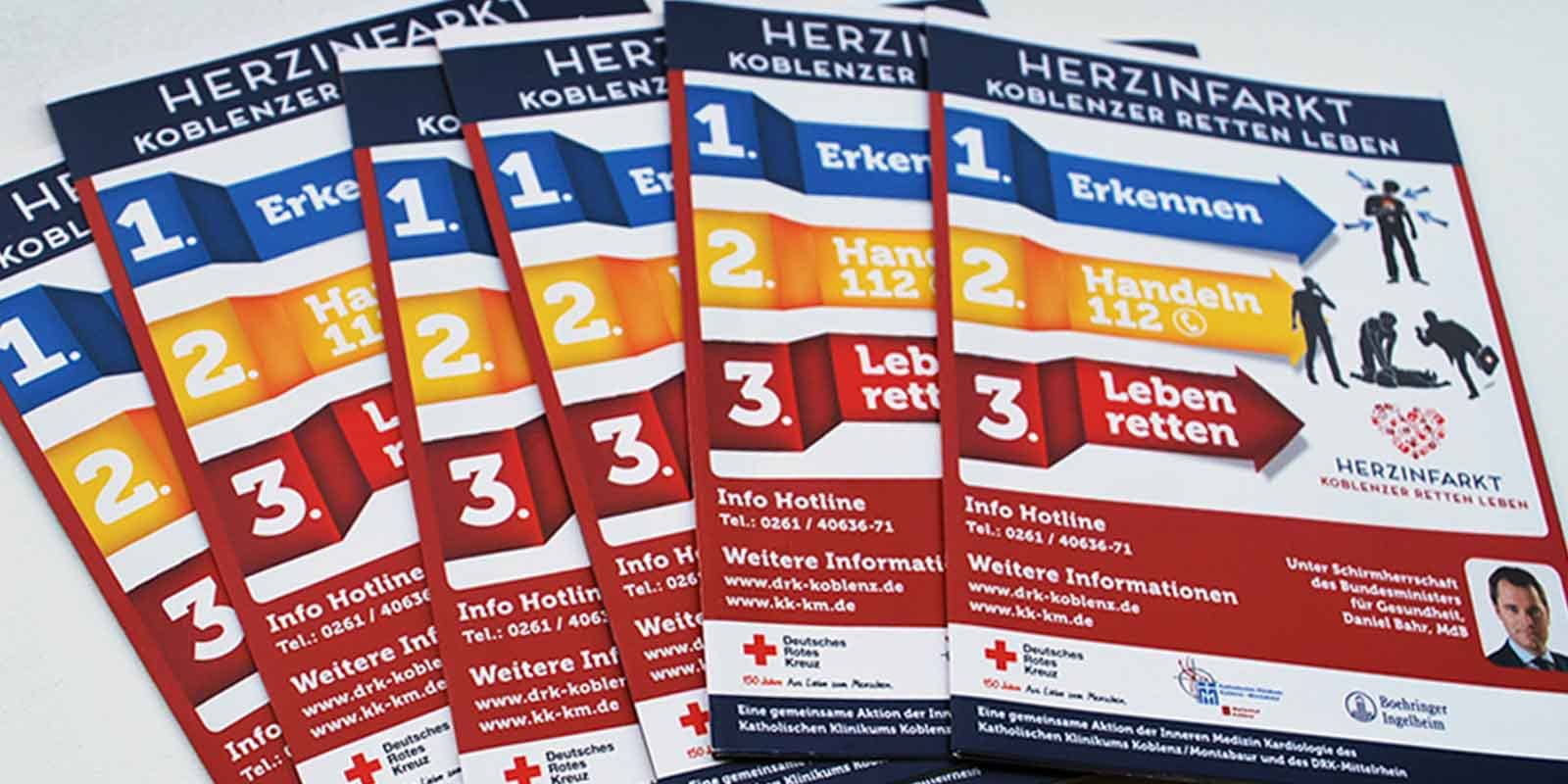 Stack of Brochures showing Creative Direction, Custom Design and Wordpress Development, Marketing for DRK German Red Cross